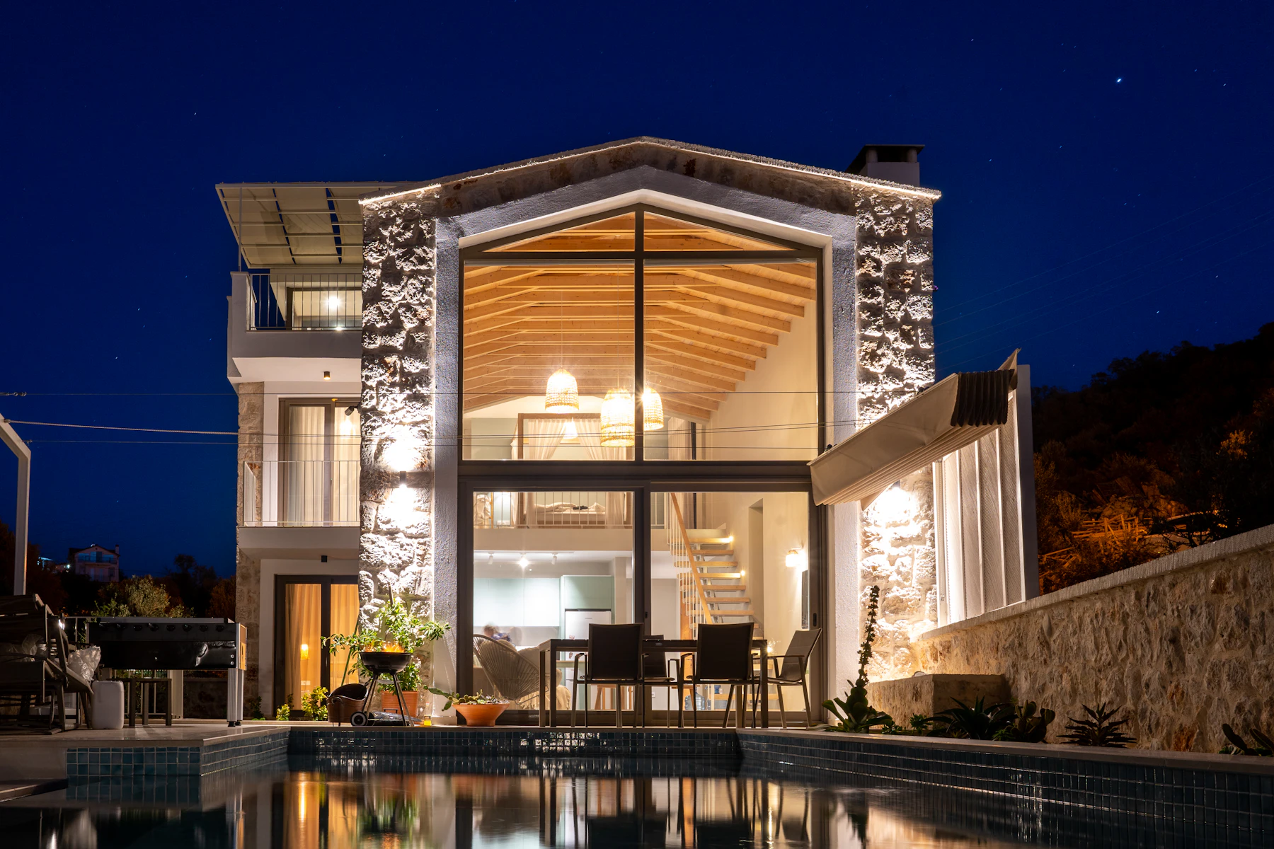 Villa exterior lit at night